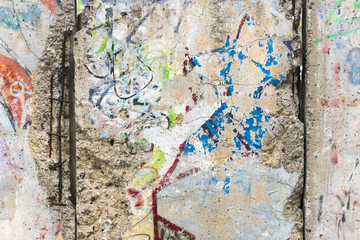 Naklejka premium Close-up part of Berlin Wall. View from the West Berlin side of graffiti art on the Wall
