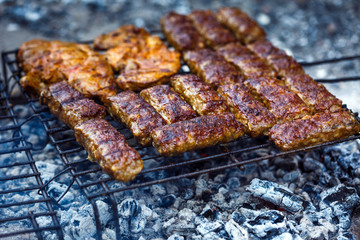 Minced meat rolls on bbq