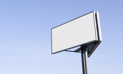 Blank billboard against sky background