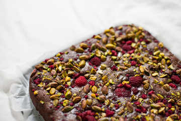 Homemade dark chocolate, raspberry and pistachio nut brownies