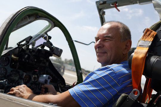Senior man in fighter cockpit