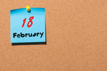 February 18th. Day 18 of month, calendar on cork notice board background. Winter concept. Empty space for text