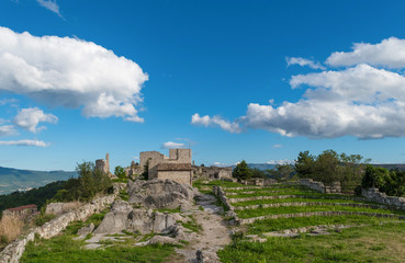 Fototapeta na wymiar Gessopalena (Abruzzo, Italy) - In the Gessopalena town there is a public archeological site of the old medieval village in gypsum stone, now destroyed, with the suggestive view of Majella mountains. 