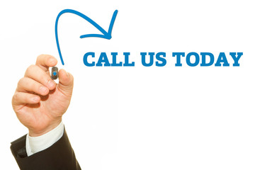 Hand writing CALL US TODAY with a marker on transparent wipe board.