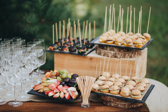 Table with snacks is in the area of wedding party