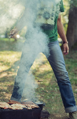 Man making barbecue in the park