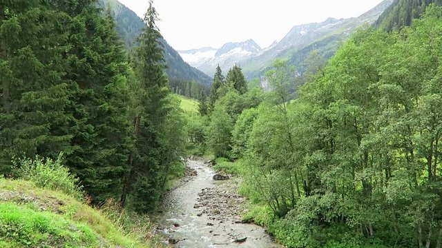 Zillertal valley landscape with meadow, barn and stream. Located at Schoenachtal valley in Tirol (Austria).