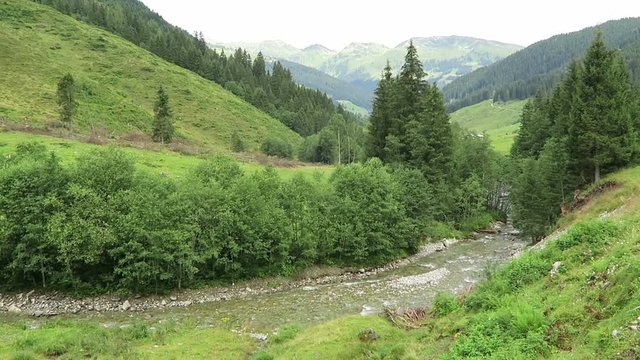 Zillertal valley landscape with meadow, barn and stream. Located at Schoenachtal valley in Tirol (Austria).