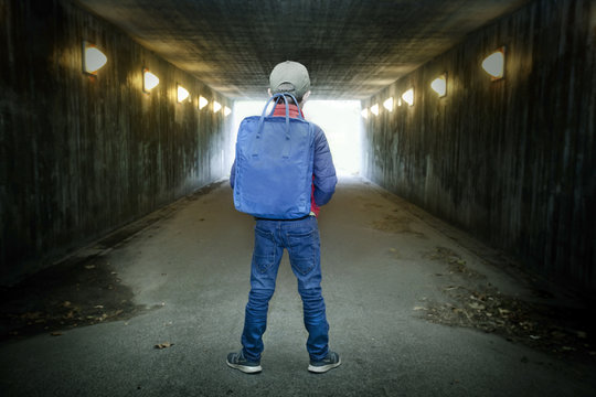 School Child Walking In A Dark Subway