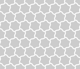 Seamless background of curved hexagons. Looks like puzzle od stars. Simple abstract pattern vector background in grey with white outline.