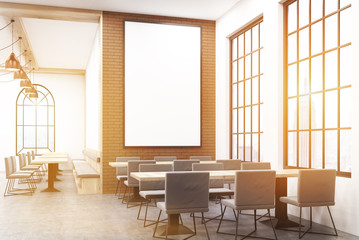 Sunlit coffee shop with poster
