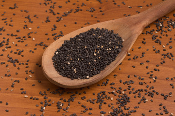 Black Sesame Seeds into a spoon