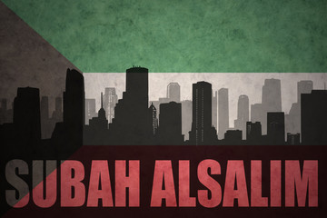 abstract silhouette of the city with text Subah Alsalim at the vintage kuwait flag background
