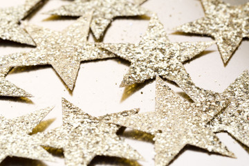 Christmas gold stars decoration on abstract background.