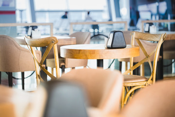 Wooden furniture in airport cafe. Nobody scene.
