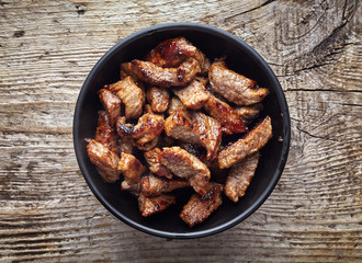 Bowl of grilled beef chunks, from above