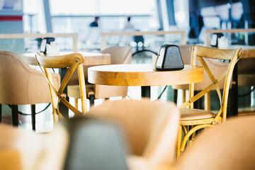 Wooden furniture in airport cafe. Nobody scene.