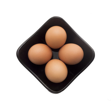 Egg, Brown Eggs in Square Black Plate, Isolated on White Backgro