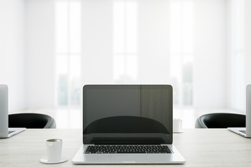 Cafe table with laptop closeup