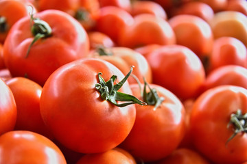 Fresh organic tomatoes on street market stall