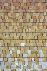 Urban background. Many samples of pavement tiles of black, orang