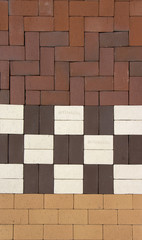 Urban background. Many samples of pavement tiles of black, orang