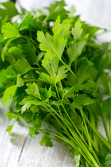 bunch of parsley on wooden surface
