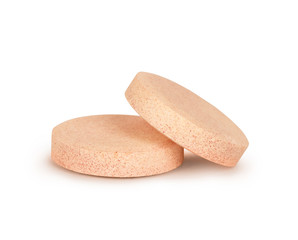 close-up of two vitamins pills isolated on white background