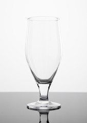 Empty beer glass isolated ob black board elegant