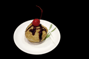 fried ice cream topped with chocolate