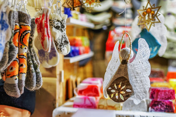 Handmade linen angel and socks hanging at Riga Christmas market