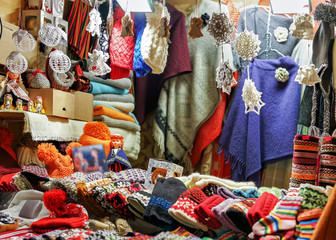 Fototapeta premium Stall with colorful woolen clothes at Riga Christmas market