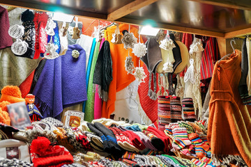 Stall with colorful woolen clothes at the Riga Christmas market