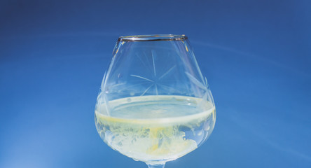 Wine glass filled with red and yellow ink