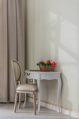 Vanity table and armchair in home interior