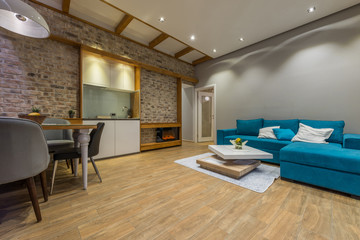 Interior of a modern living room with blue sofa in luxury mansion