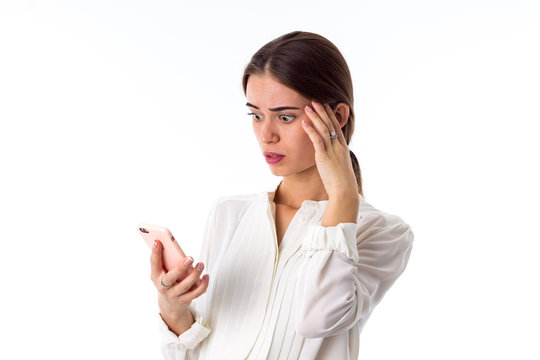 Woman looking scaredly on her phone 