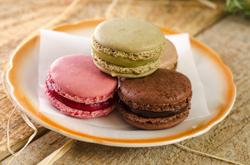 Closeup three macaroons on plate