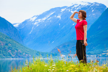 Tourist woman enjoying fjord view in Norway