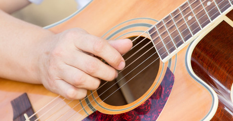 Fototapeta premium hand man playing the guitar