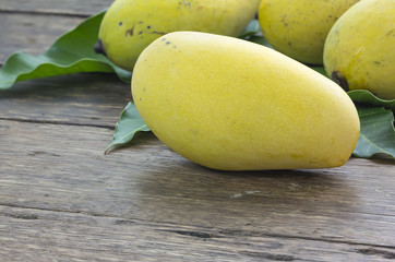 Close up mango ripe on a wooden background