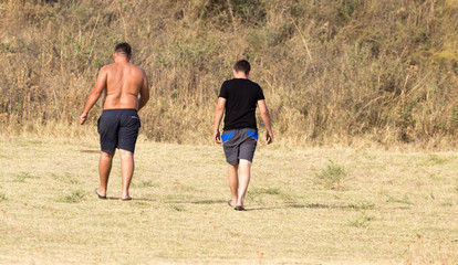 two men in shorts outdoors