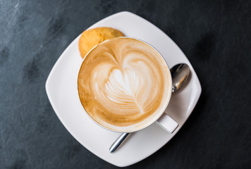 Latte Coffee art on the table .