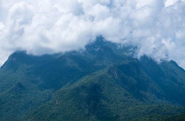 Fototapeta premium Cloud on top of the mountain