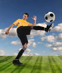 Fototapeta premium Soccer Player Kicking Ball