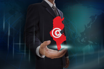 Businessman showing map of Tunisia on globe background