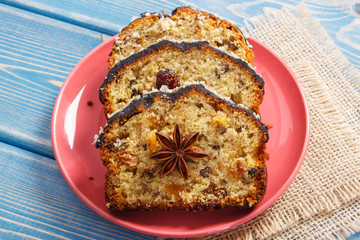 Fresh baked fruitcake on plate on boards