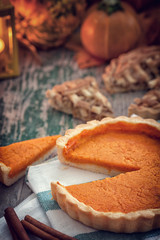 Thanksgiving pumpkin pie on wooden background 