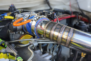 Mig welded seam on stainless steel pipe in racing car
