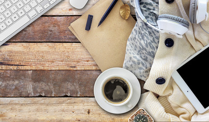 home business desk with communication device and white sweater. empty space for text. selective...